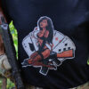 Black AK Operators Union T-shirt with AKOU Devil Girl - zoomed view